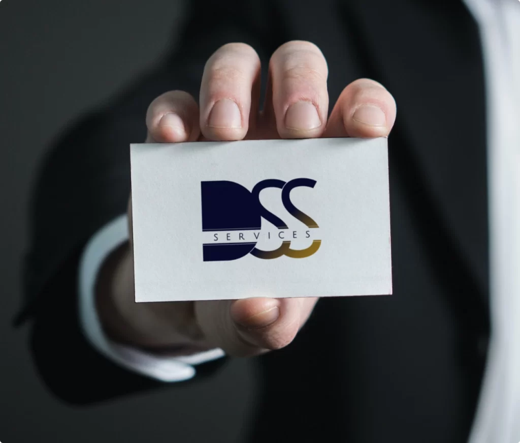 A business card with DSS Services logo. Page About us.